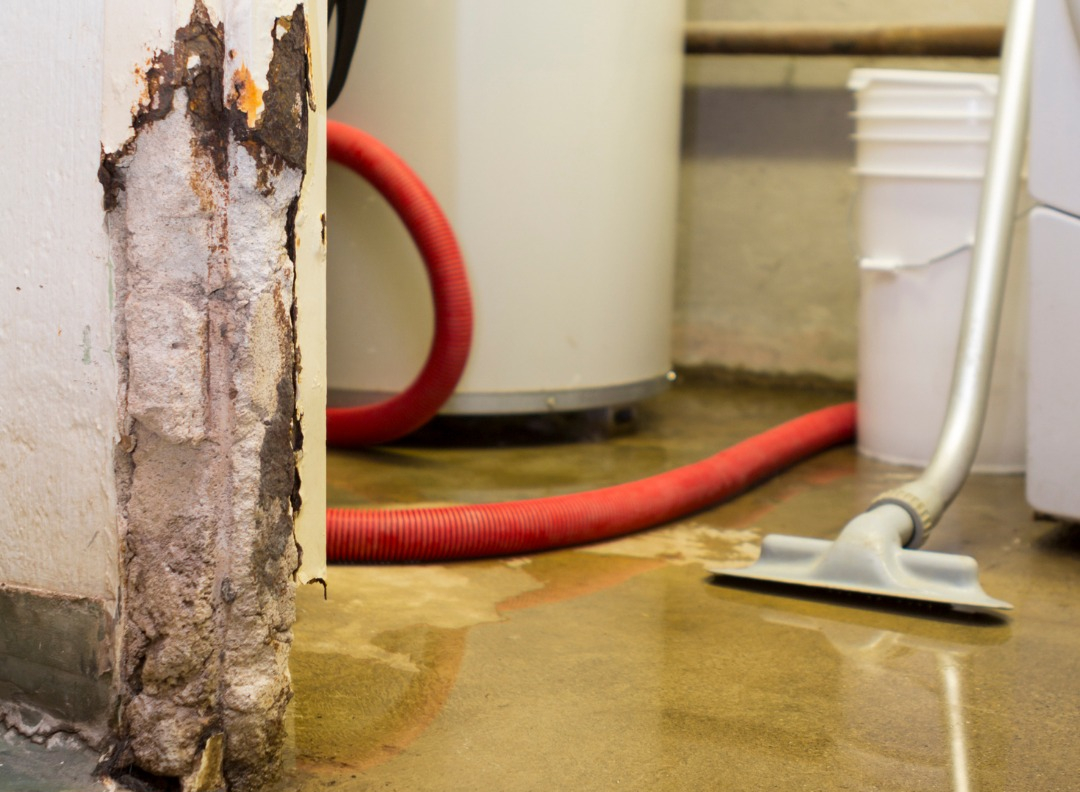 Vacuuming Up Water and Floor Restoration